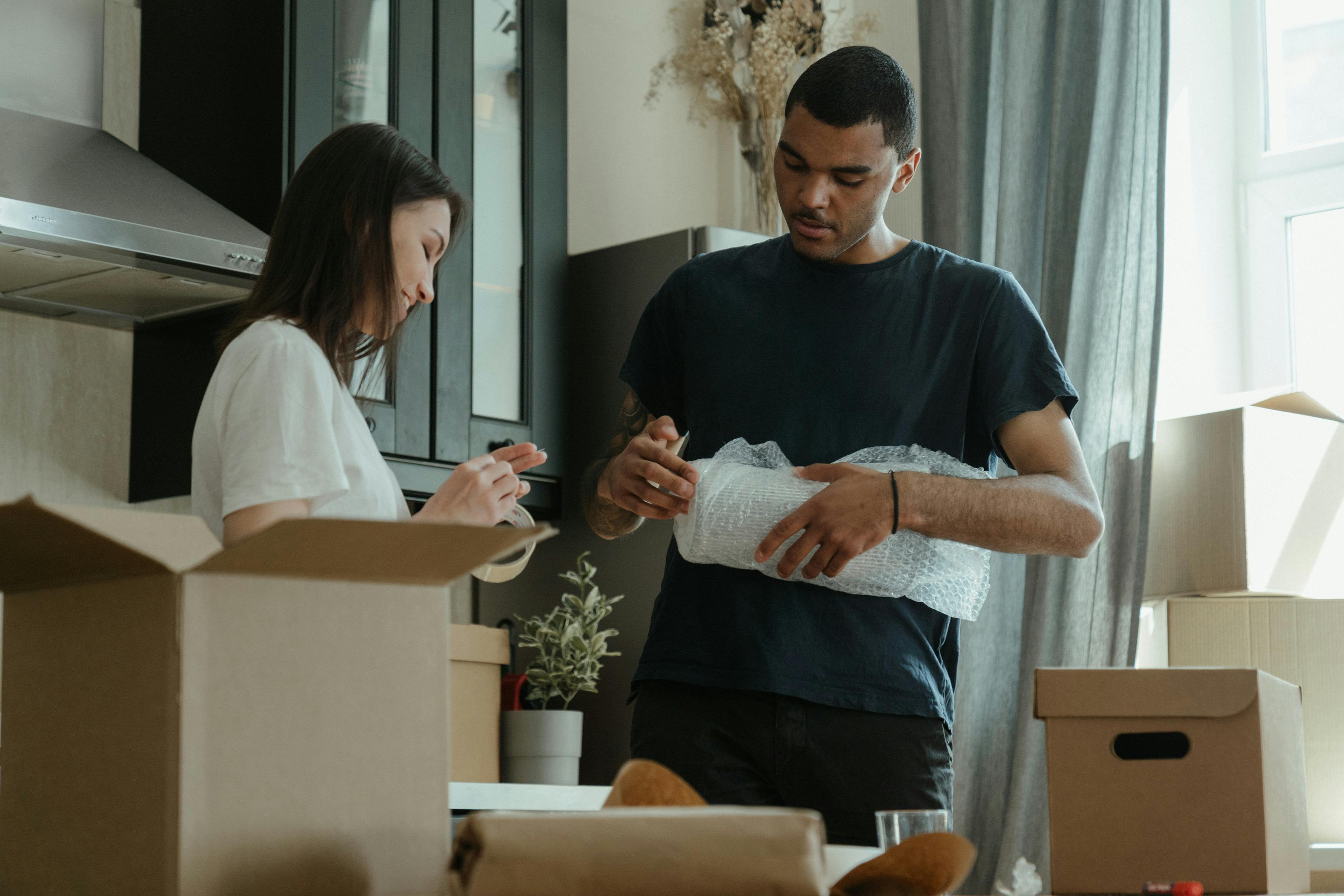 Couple packing their stuff before moving